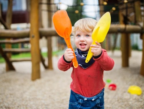 toddler-boy-playing-in-the-playground-summer-day-PB8C7FR.jpg